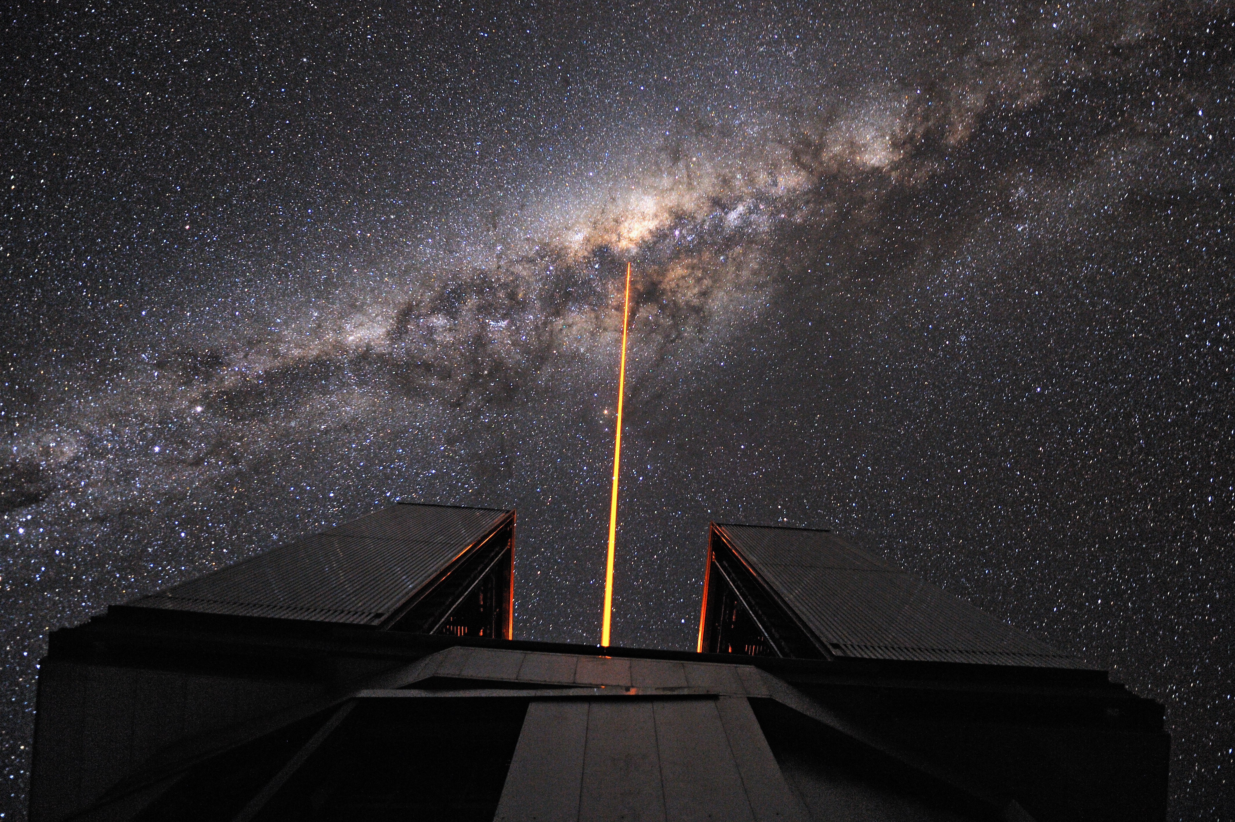 Part of the European Southern Observatory's Very Large Telescope, this laser guide star helps astronomers correct blurry images caused by atmospheric turbulence. Photo credit: G. Hüdepohl/ESO