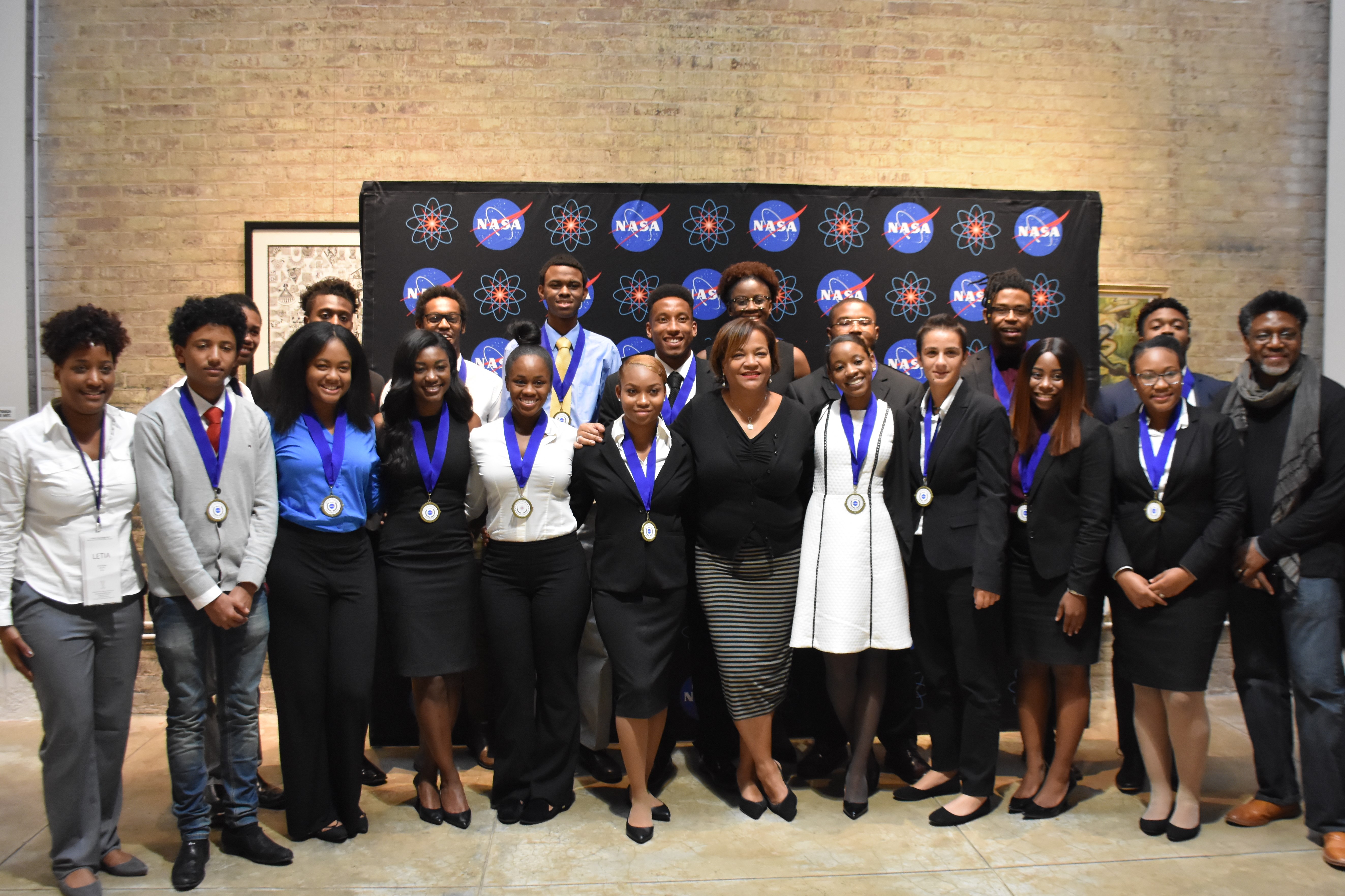 Nona Cheeks, (center), Chief of NASA Goddard Space Flight Center’s Technology Transfer Office and Von Nkosi, President of Liquid Studios, (right), pose with the participants of the 2017 Institute for Local Innovations, Inc. (ILI) T.I.M.E. Challenge.